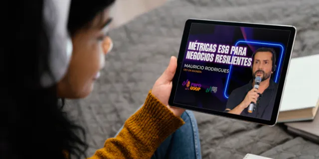 Tablet showing the Papo Coop episode on ESG metrics for resilient businesses, featuring Mauricio Rodrigues